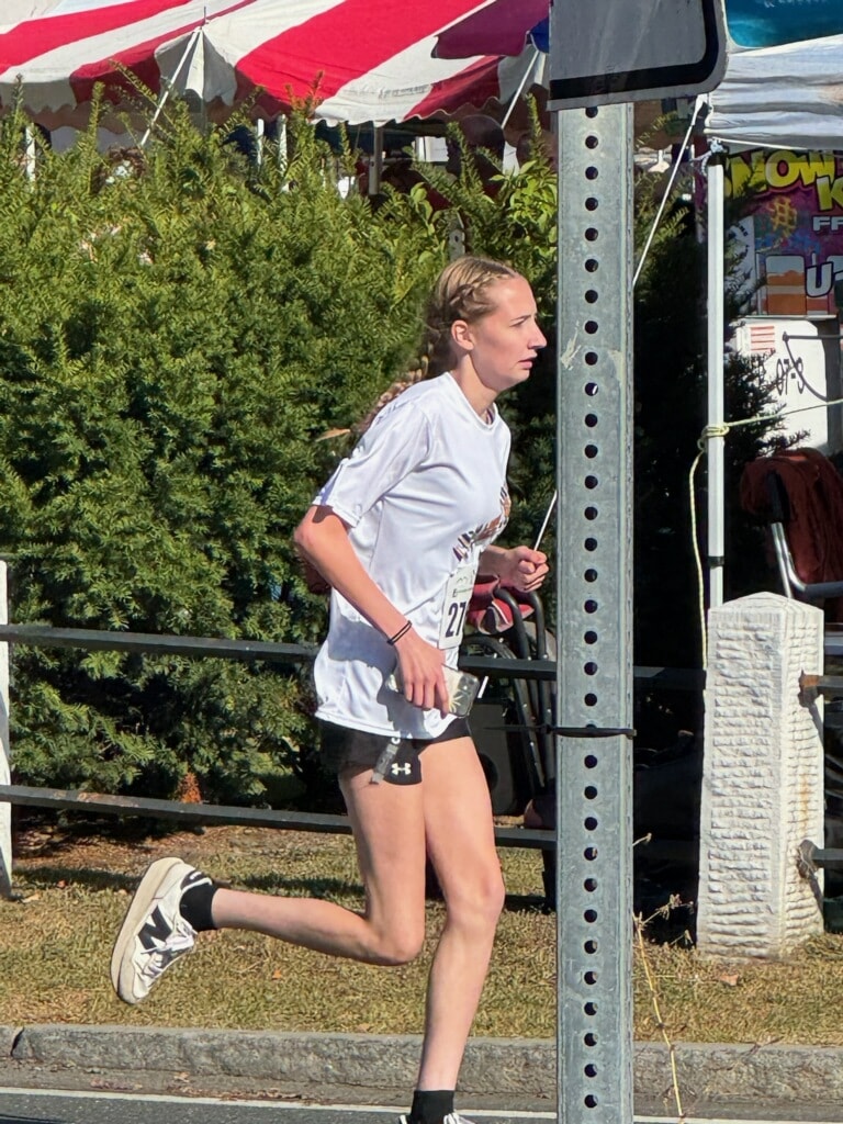 So proud of Lexi for running in her first race!  She did great in today's Main Street Mile! 

(Photo credit: Sue Gore :))